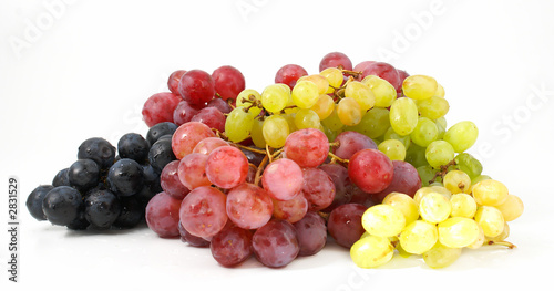 three various grades of grapes