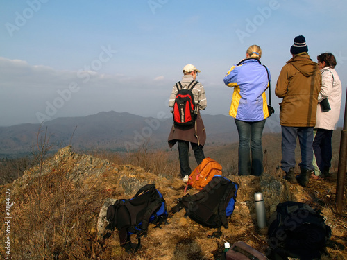 group of hiking people on the mountain top