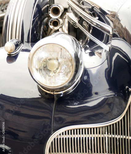 headlamp and grill of a classic car