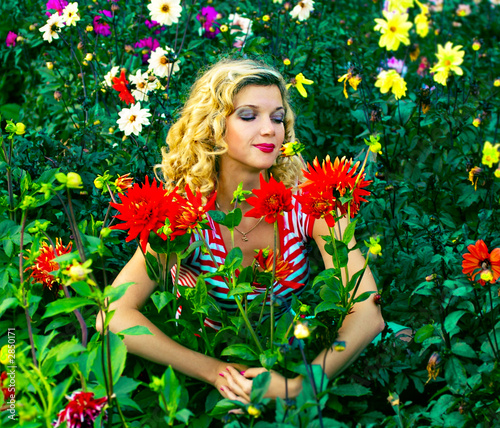 beautiful girl hugging dahlia flowers