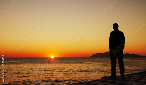man looking on sunset