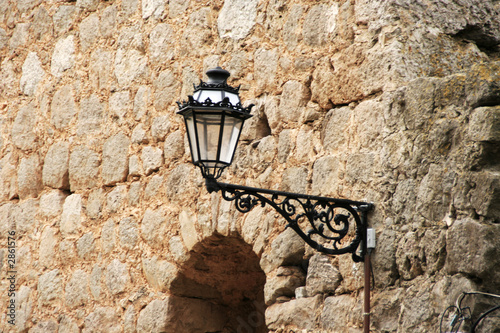 lamp fixed to an old wall