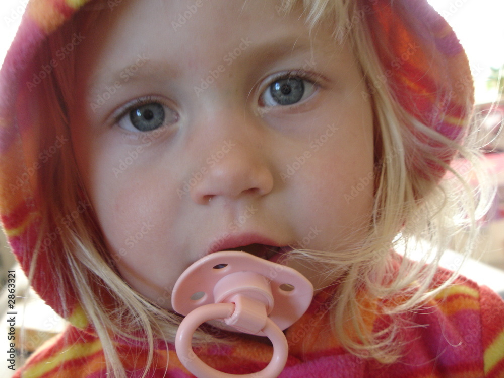 Cute, 2 year old girl with pacifier Stock Photo Adobe Stock