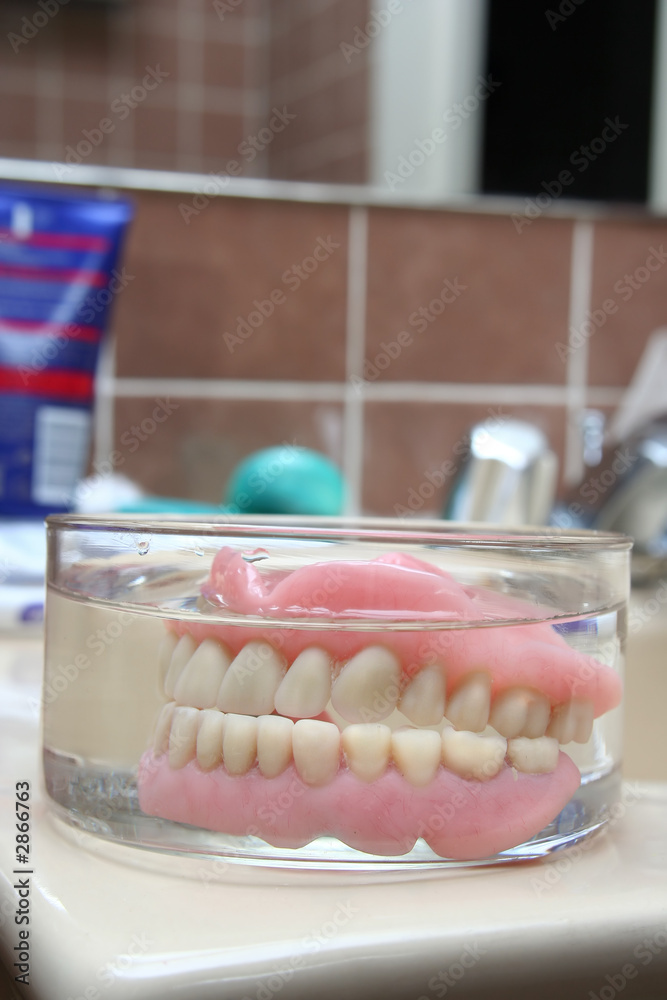 artificial denture in a glass artificial denture in a glass