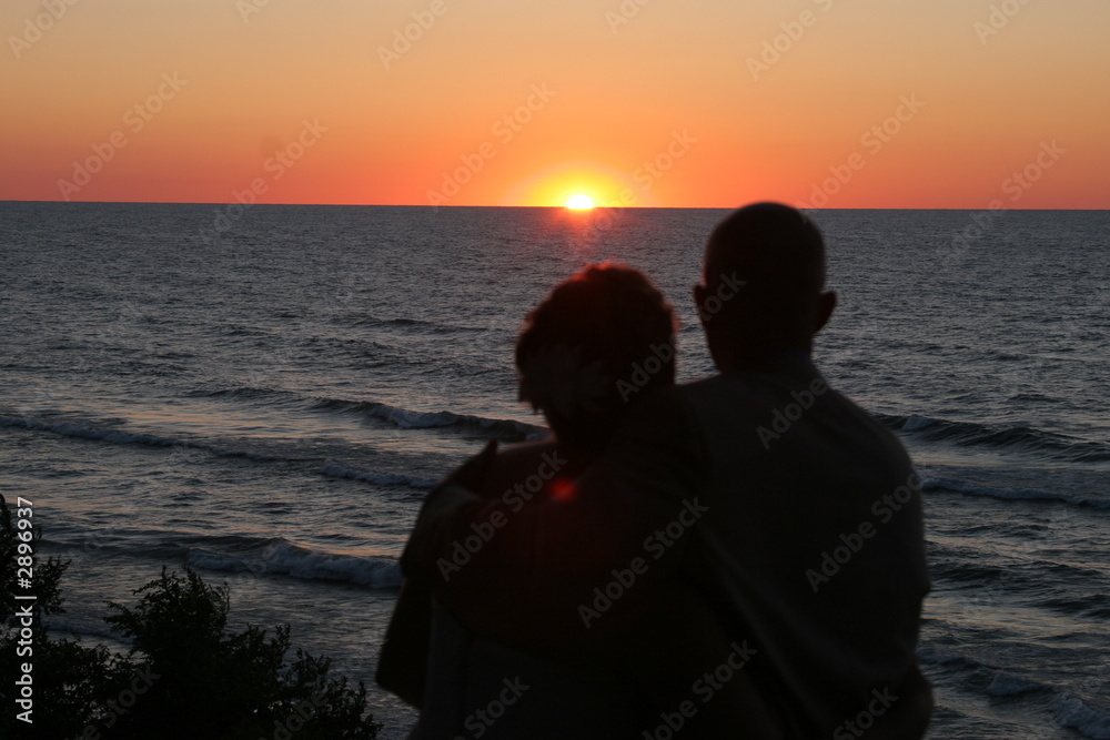 couple silhouette watching sunset