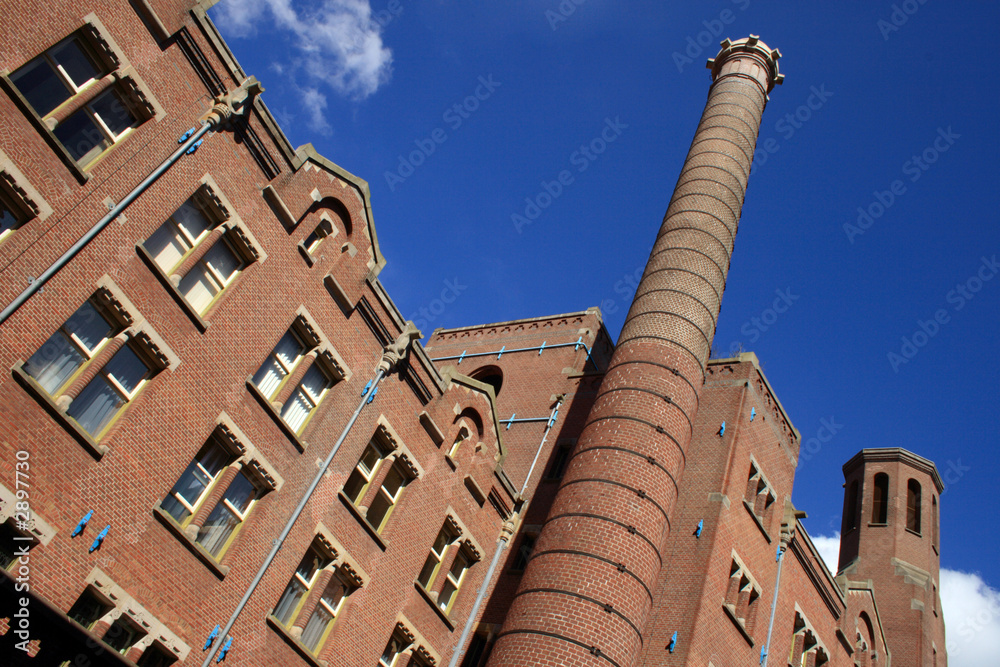 Obraz premium brick building and chimney tower