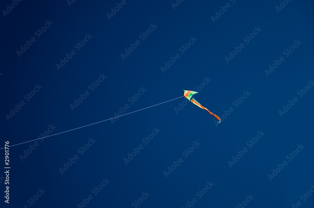 kite on dark blue sky background kite on dark blue sky background