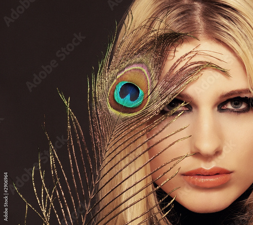 a girl with a feather.