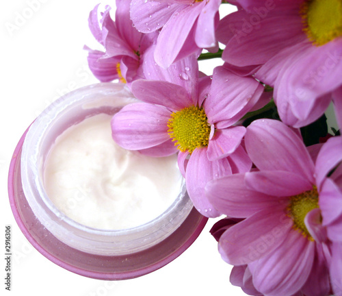 violet container of cosmetic moisturizing cream with flowers