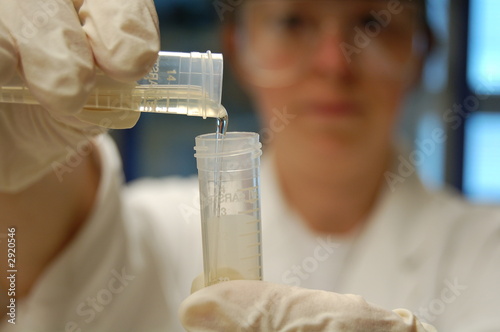 working in lab with test tubes