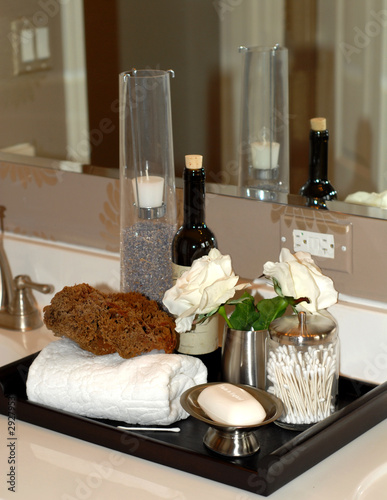 toiletries and bath items on bathroom vanity