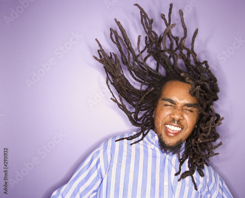 Φωτογραφία african-american man with his dreadlocks in motion.