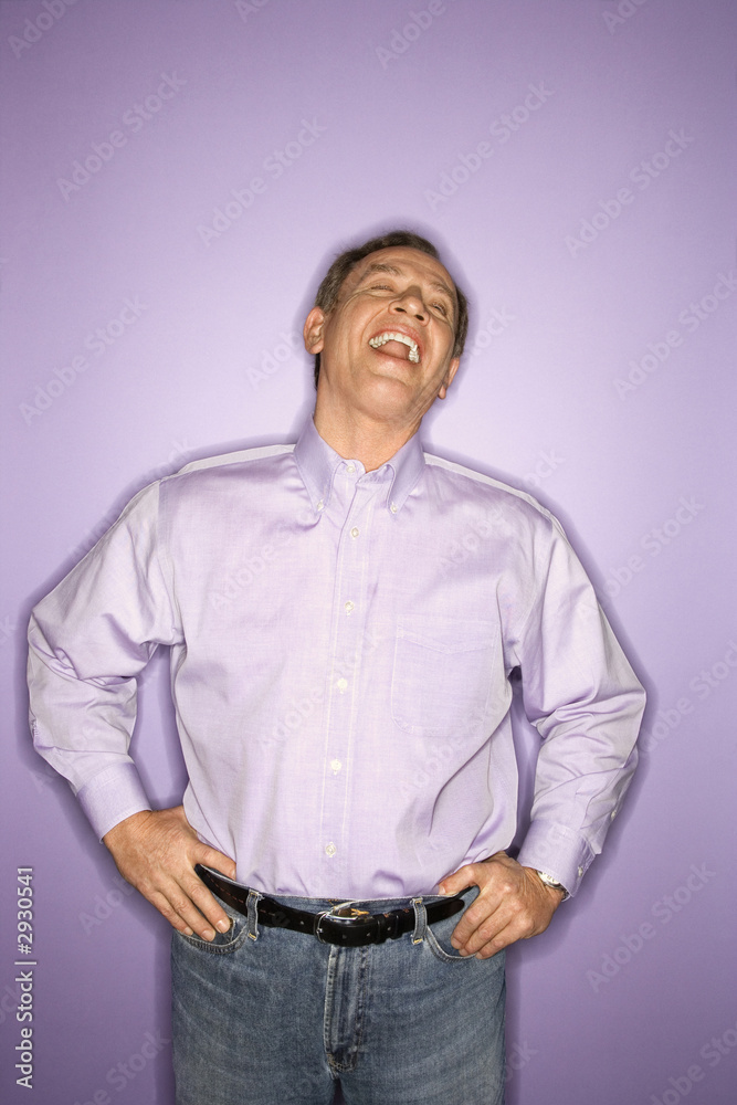 Obraz premium laughing caucasian man wearing purple clothing.