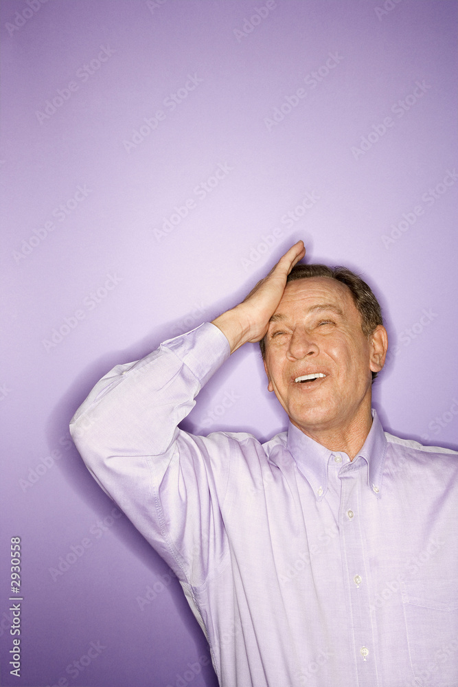caucasian man with his hand on forehead. caucasian man with his hand on forehead.