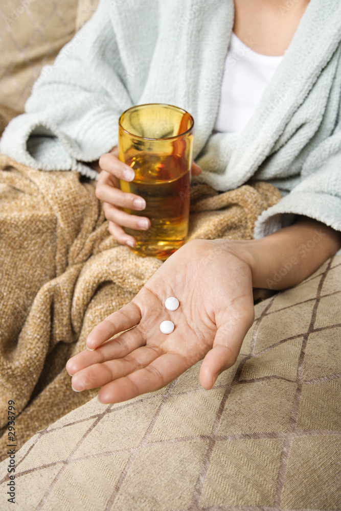 woman holding pills and glass of water. woman holding pills and glass of water.