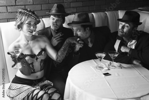 Tablou pe pânză three retro businessmen wooing female.