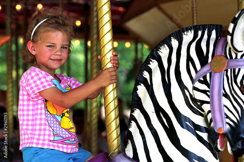 girl on carrousel photo