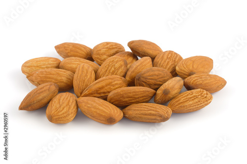 pile of almonds isolated on white background