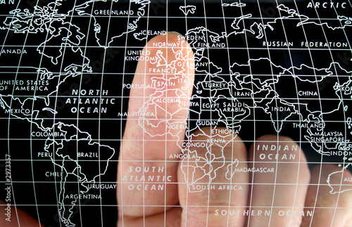 world map finger pointing at uk photo