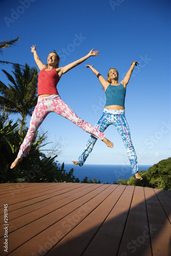 Women jumping into air.