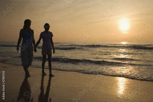 Mom and daughter at sunrise.