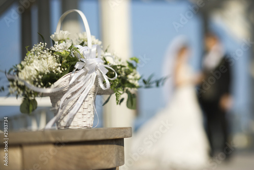 Canvas Print Flower basket with bride and groom.