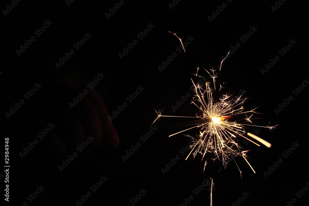 hand in dark with fire-cracker