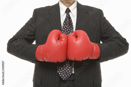 businessman wearing boxing gloves.