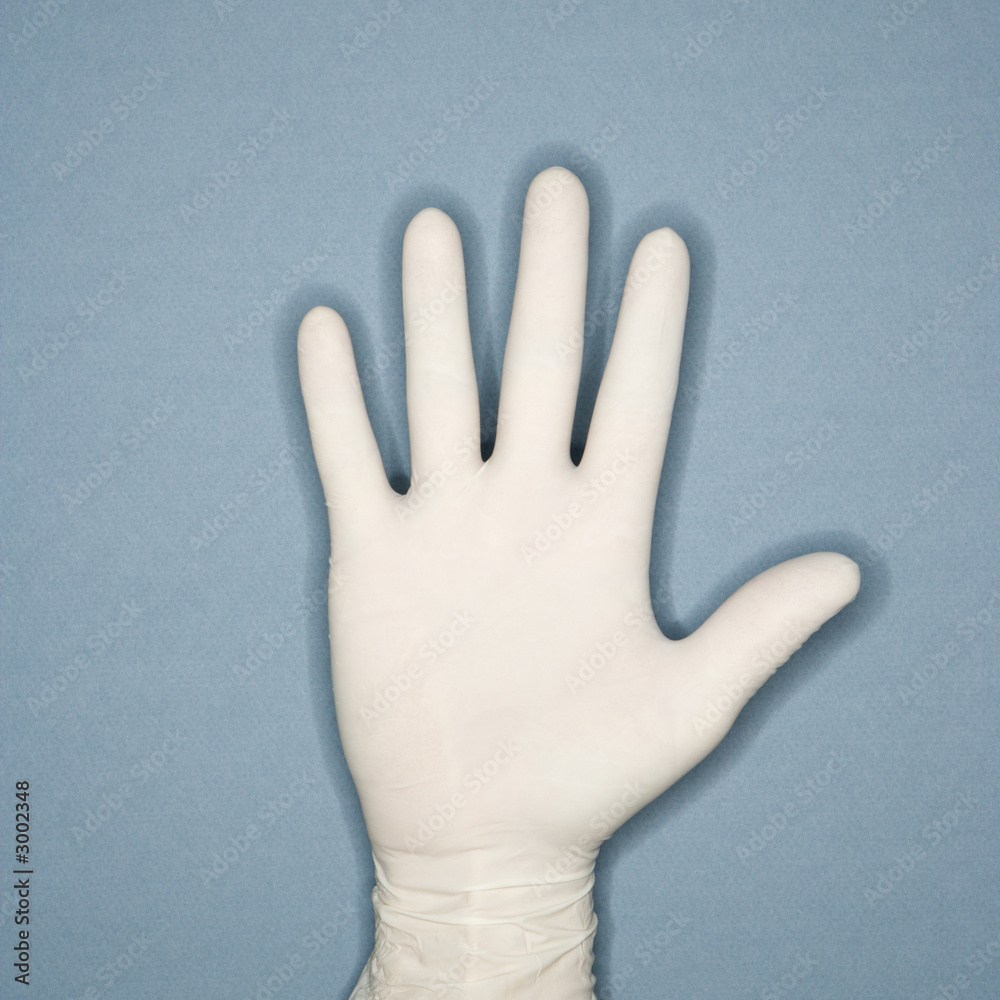 Fototapeta premium hand wearing rubber glove.