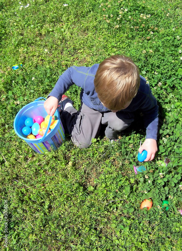 boy hunting easter eggs