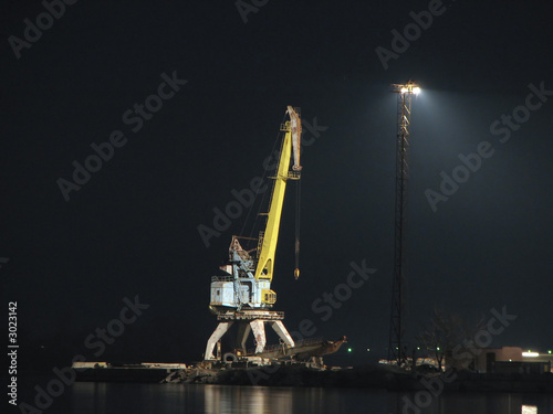 port crane on the bank of the dnieper night, ukrai photo