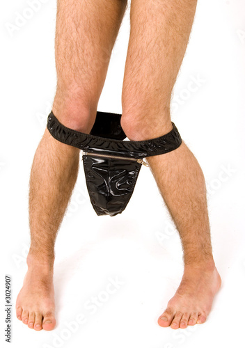 nude man legs with leather lingerie taken off