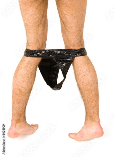 nude man legs with leather lingerie taken off