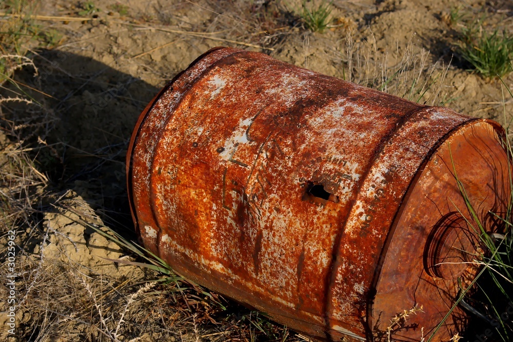 barrel with bullet hole