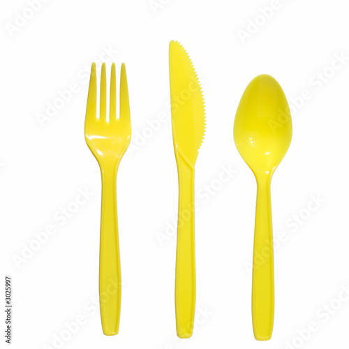 vibrant yellow plastic  fork, knife and spoon