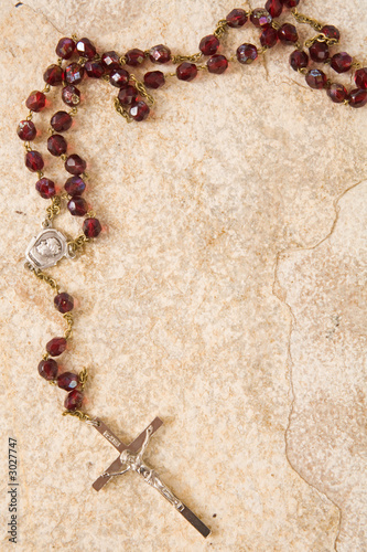 rosary on stone with copy space