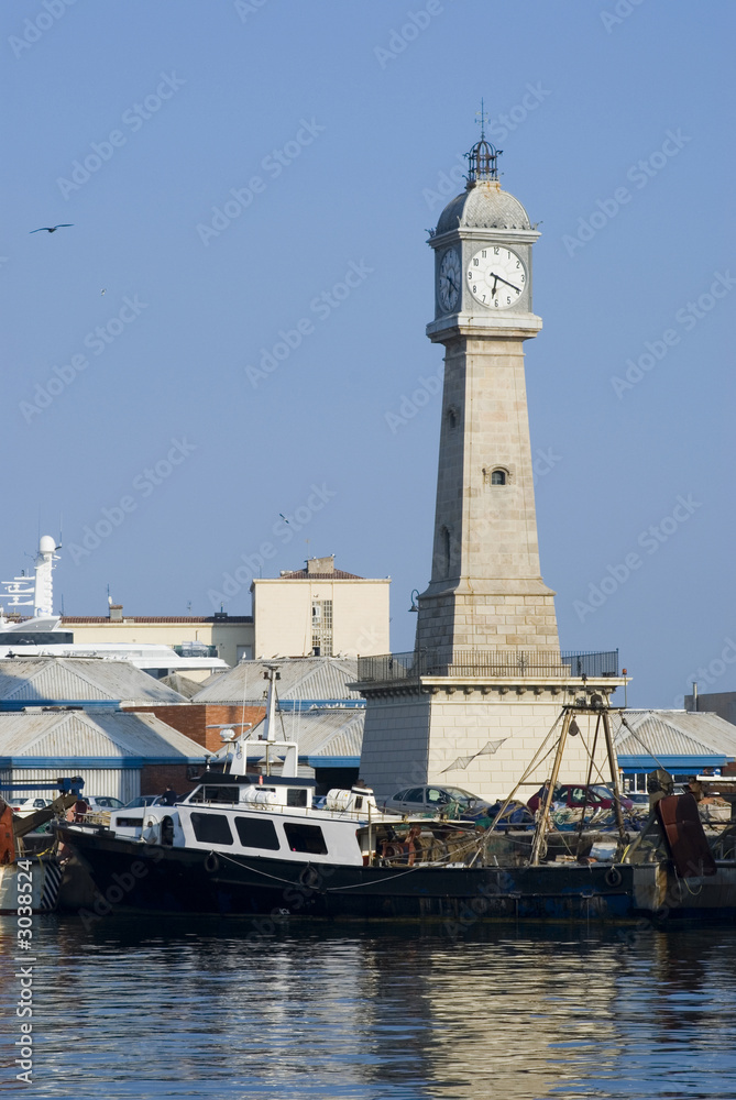 tower and fishing ship at barcelona port
