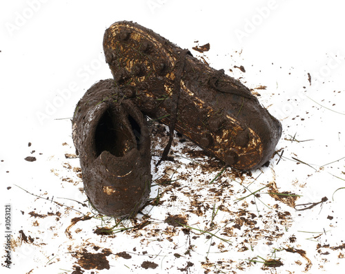 Canvas Print muddy football shoes after the game