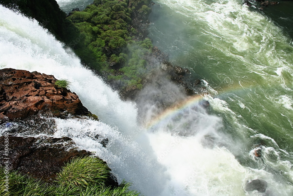 Fototapeta premium above dramatic waterfall with rainbow