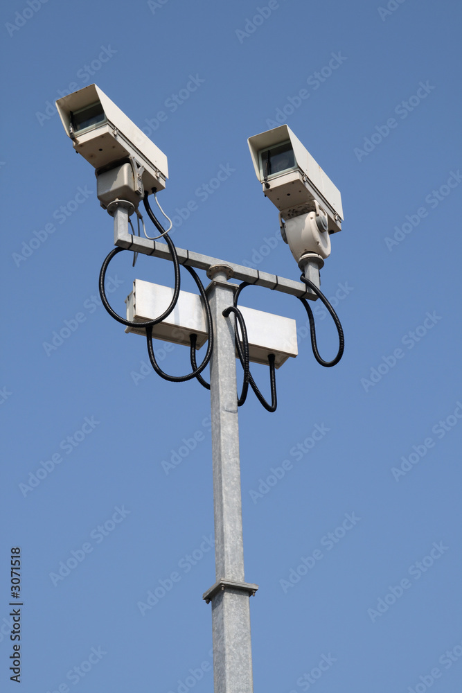two cctv street security cameras.