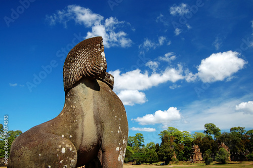 lion statue facing the prasat suor prats photo