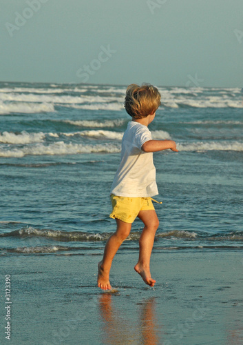 girl rinning from waves