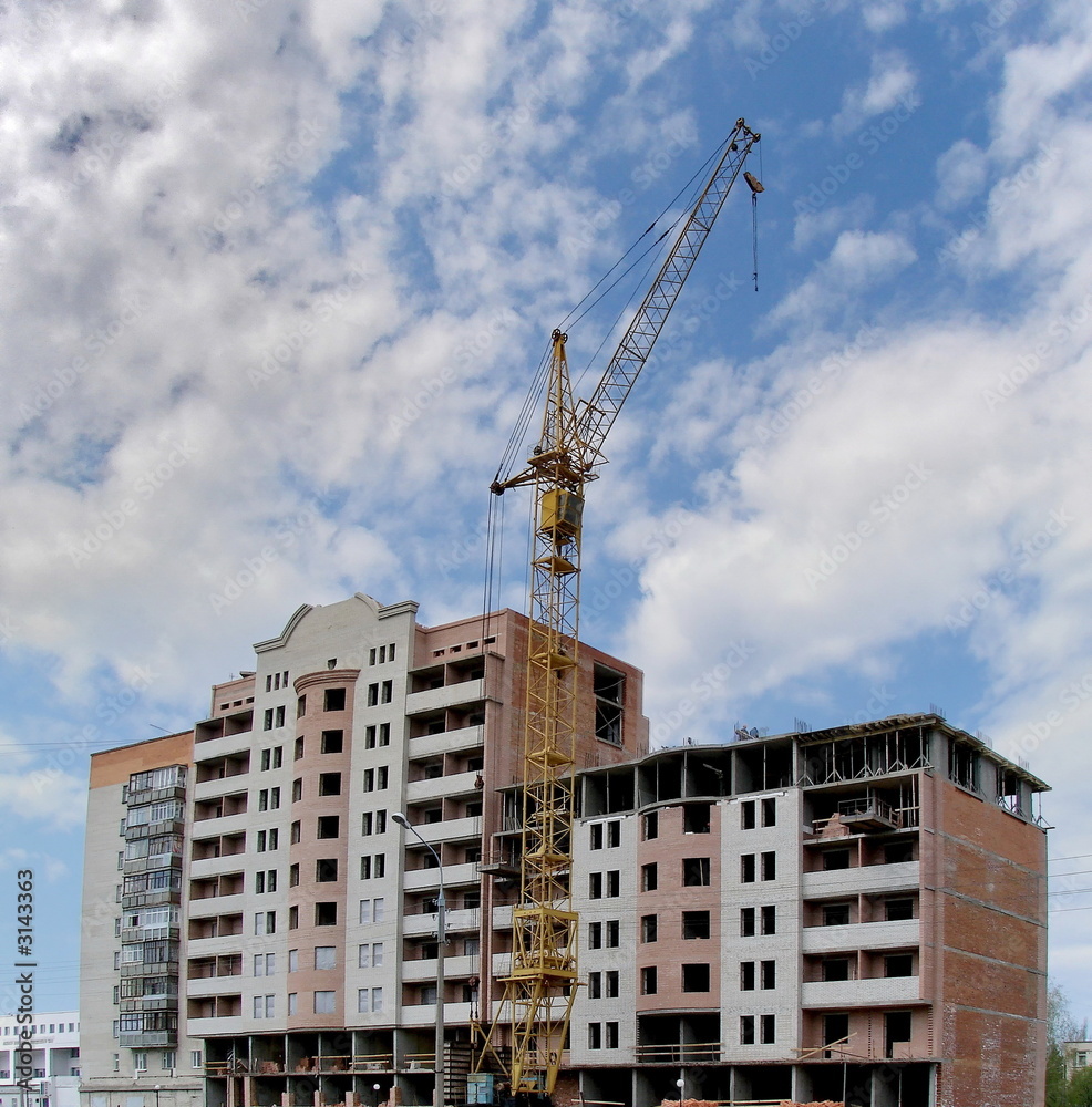 new apartments building construction with crane new apartments building construction with crane