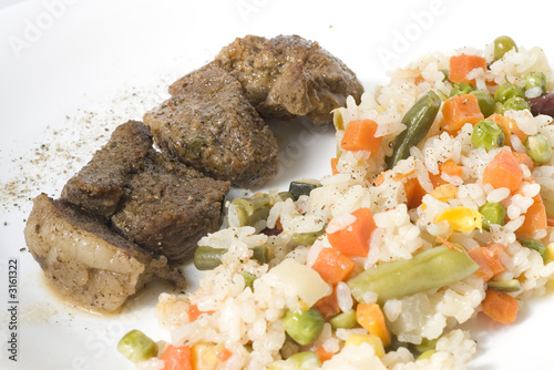 fried meat with vegetables and rice