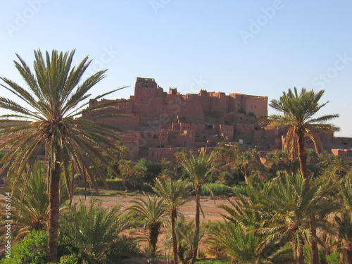 moroccan ksar fortress with palm trees, ouarzazate, morocco