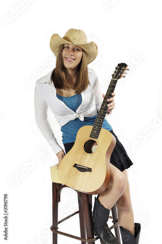 cowgirl ready to play guitar