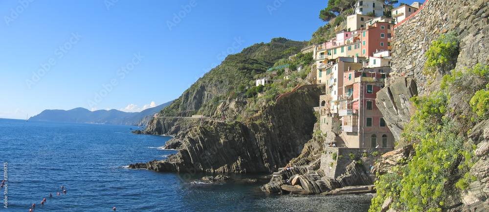 riomaggiore cliffs over the blue sea, the cinque terre, italia,