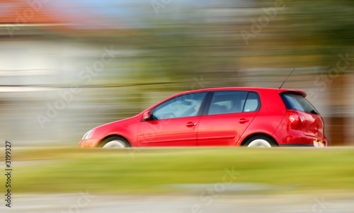 fast moving red car