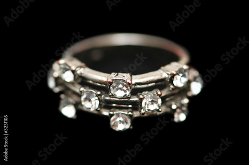 ring with diamonds isolated on the black