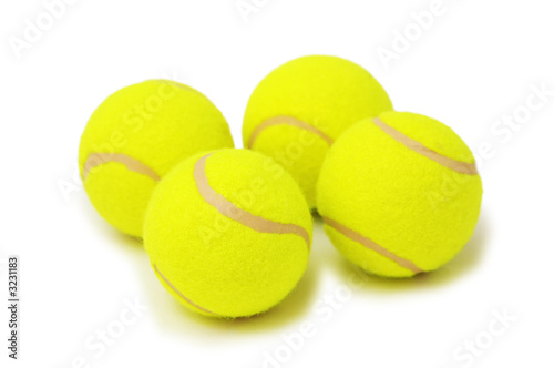 four tennis balls isolated on the white